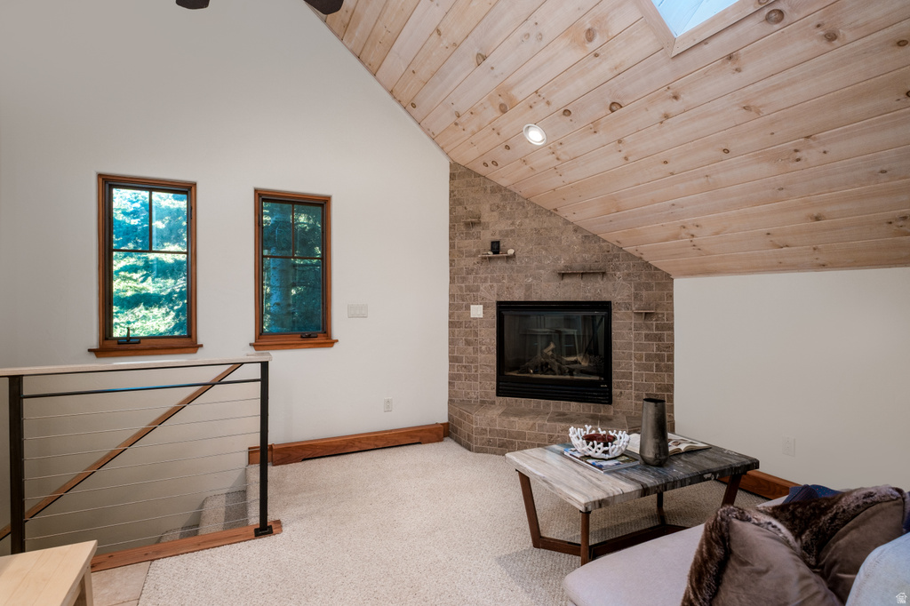 Vaulted wood-paneled ceiling with skylight and recessed lighting