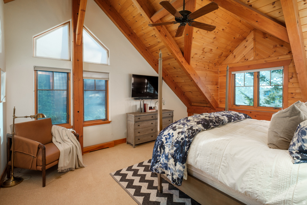 Angled wood-paneled ceiling with exposed beams
