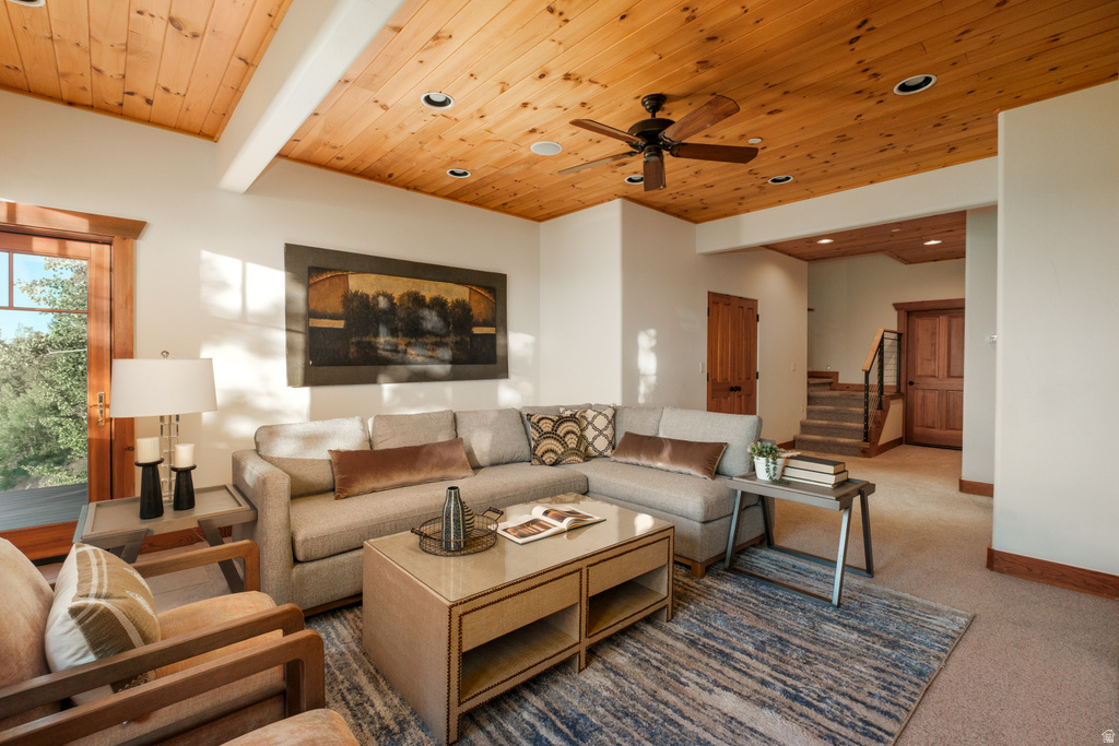Living area featuring a natural wood plank ceiling with recessed lighting and a ceiling fan