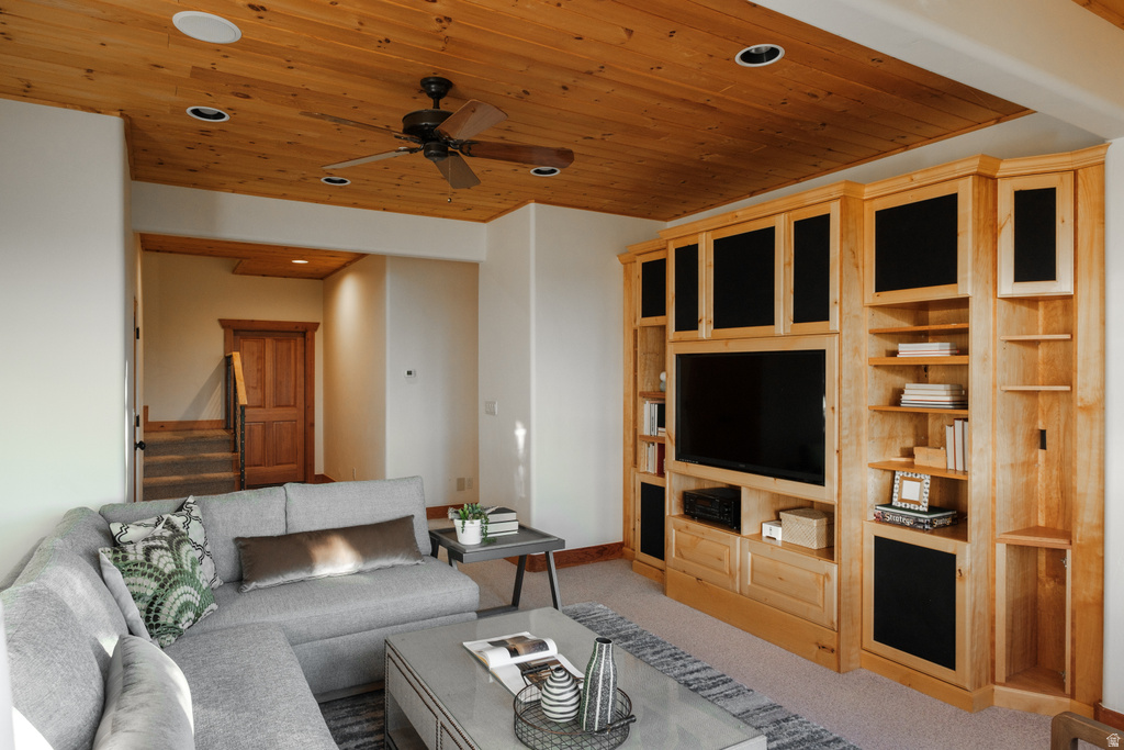 Custom built-in entertainment center featuring light wood cabinetry and integrated shelving