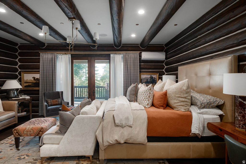 Log cabin interior featuring exposed wood beam ceiling, recessed lighting, and a chandelier