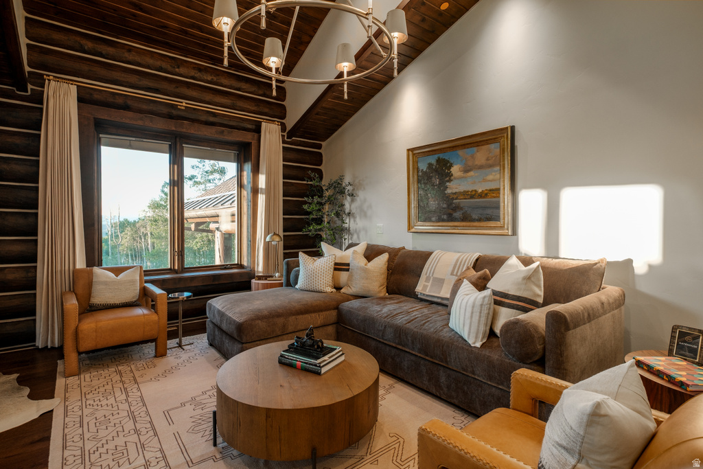 Vaulted wood-paneled ceiling with a circular chandelier