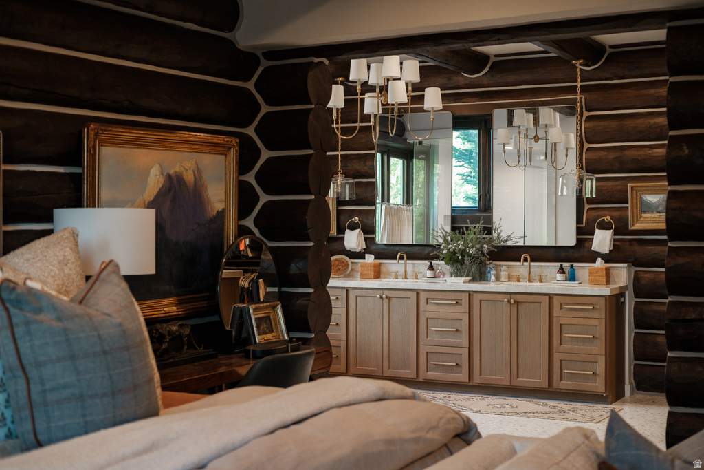 Double vanity with integrated sinks and gold-finish fixtures