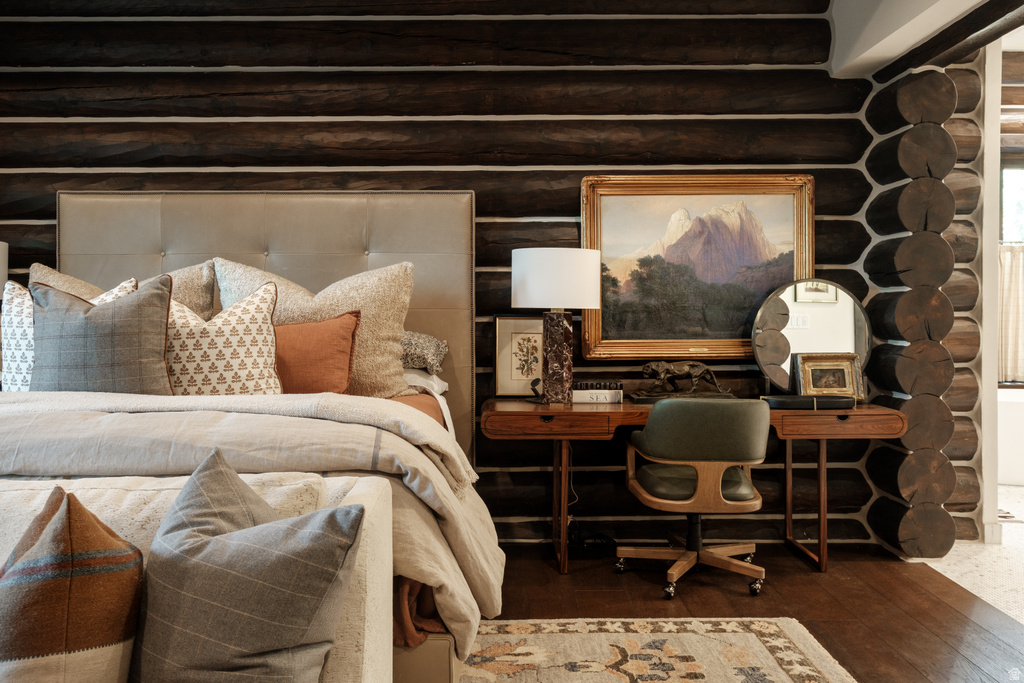 Log wall construction with dark wood tones