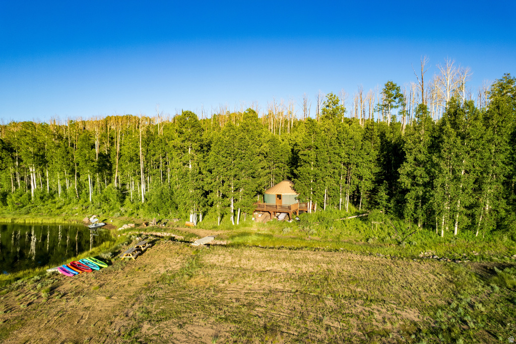 Yurt structure featuring a raised wood deck