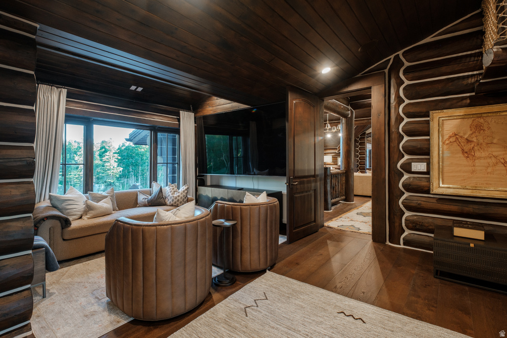 Room featuring wood-finish flooring and a wood-paneled ceiling