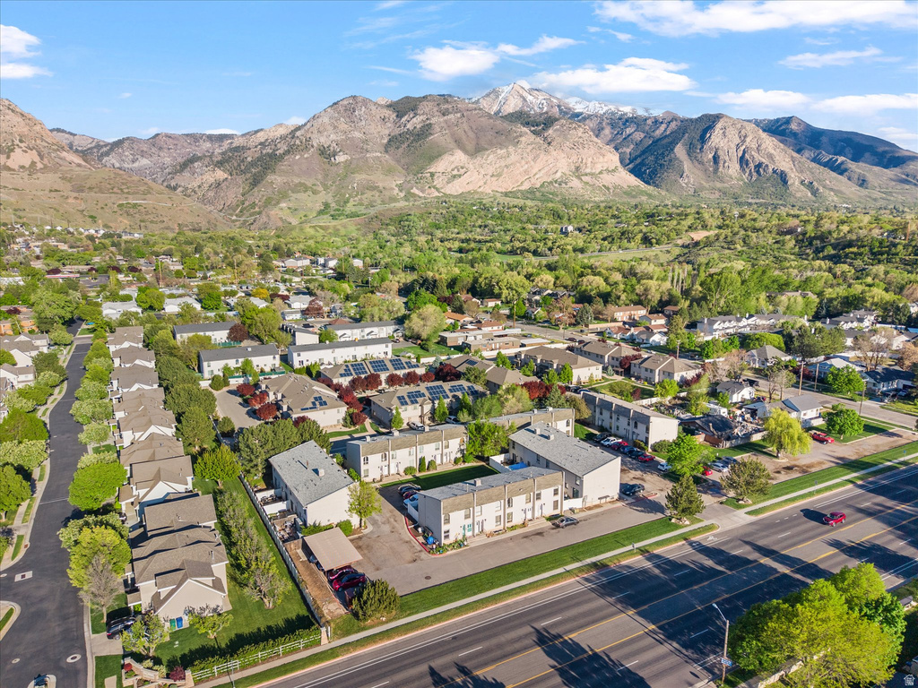 Aerial perspective showcasing residential properties with a mountainous backdrop
