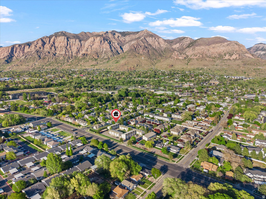 Aerial perspective showcasing a residential neighborhood with a prominent mountain backdrop
