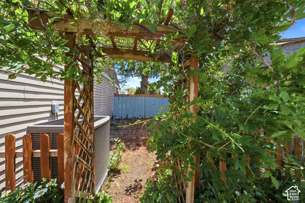 Wood arbor with climbing greenery
