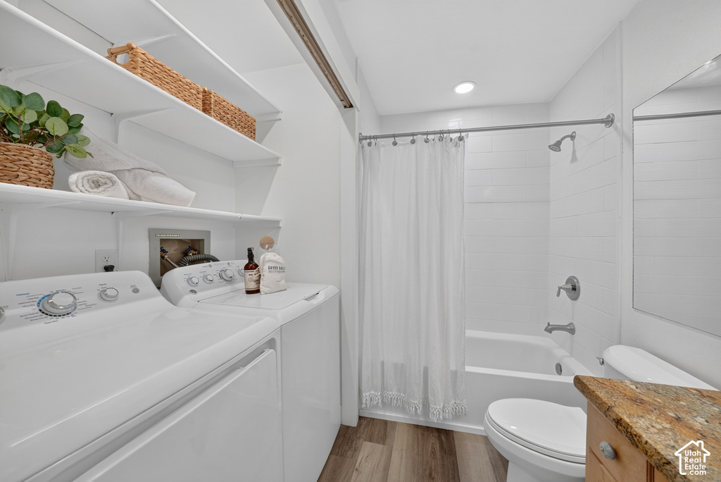 Full bathroom featuring a shower-over-tub combination with subway tile surround, recessed lighting, and a vanity with a stone countertop