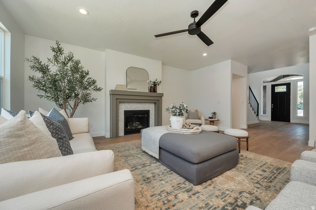Living area with a fireplace featuring a tiled surround and mantel