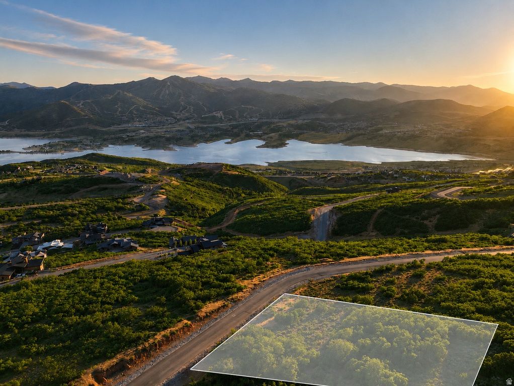 Expansive mountain and lake scenery framing a residential development