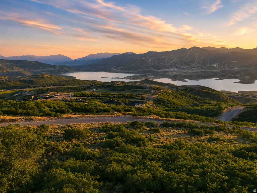 Expansive landscape featuring rolling hills and distant mountains