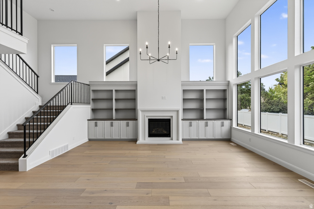 Soaring ceilings complement the expansive window wall, offering abundant natural light