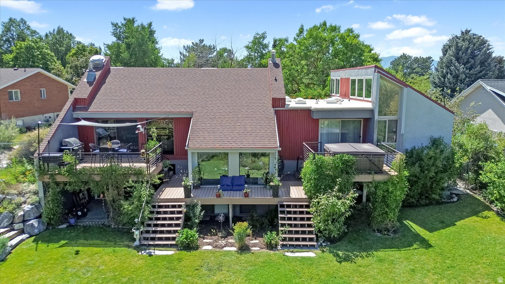 Multi-level rear exterior featuring a red and gray facade