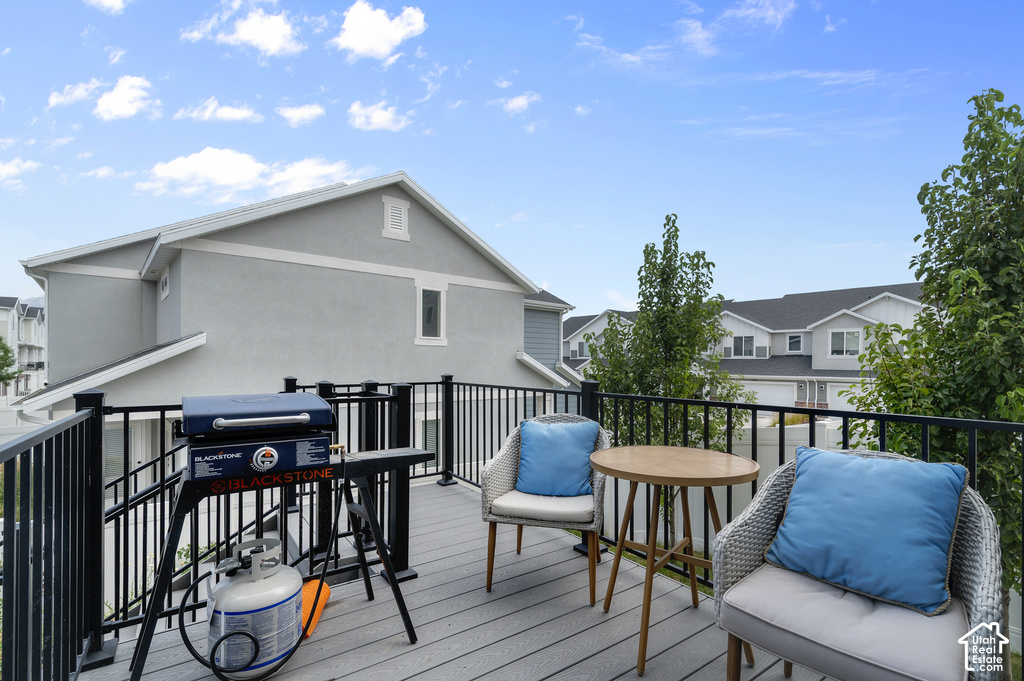 Upper-level deck featuring composite decking and black metal railings