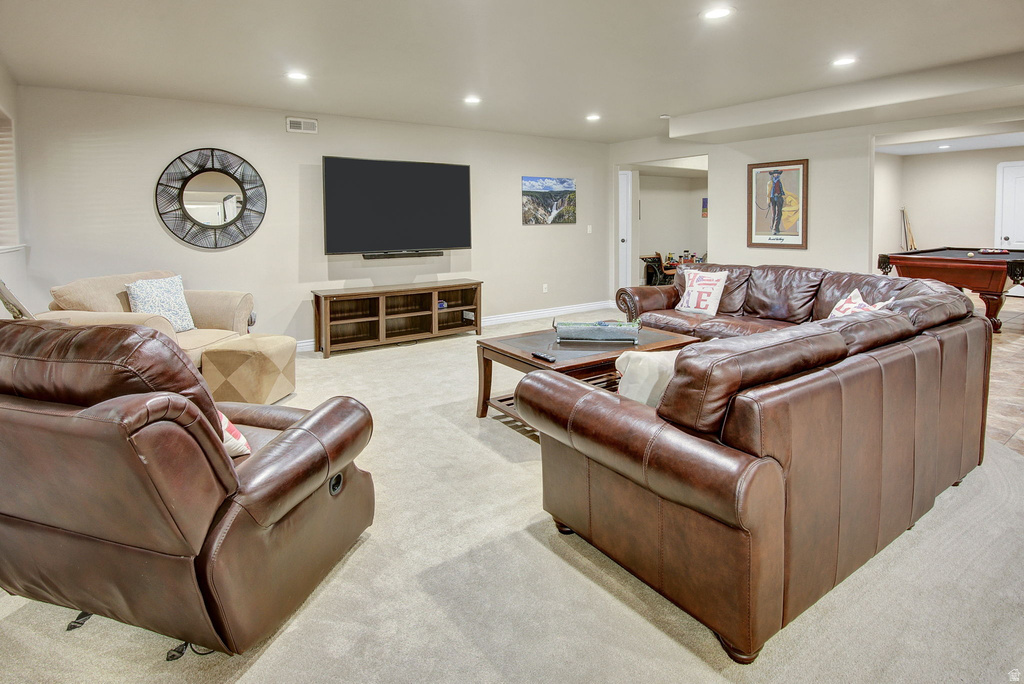 Spacious entertainment room featuring recessed lighting, light neutral wall paint, and a carpeted floor