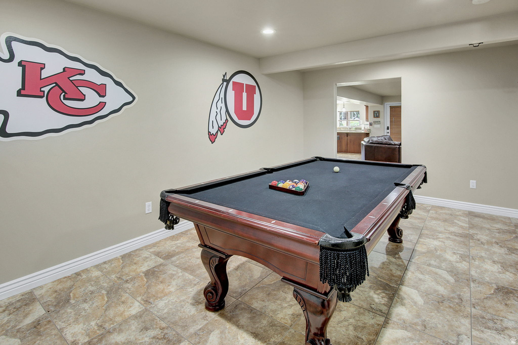 Recreational room featuring a billiard table with a dark wood frame and black felt, recessed lighting, and large format tile flooring