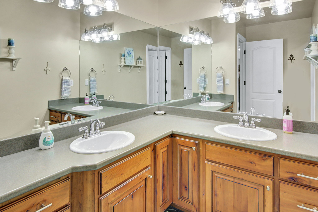 Dual vanity with oval undermount sinks and chrome fixtures