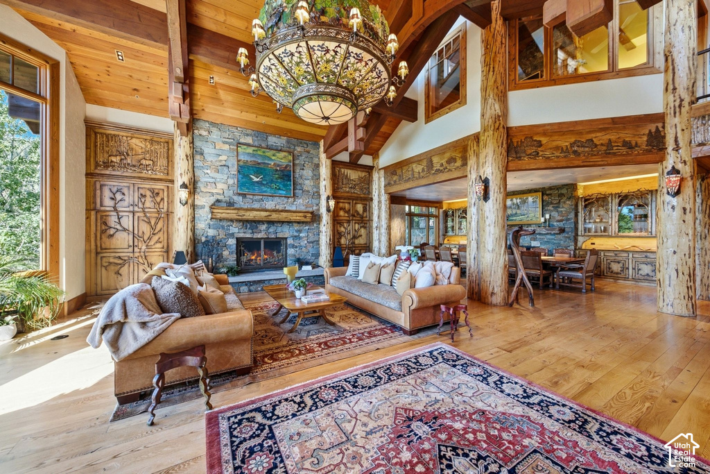 Expansive living area featuring a vaulted wood-paneled ceiling with exposed beams