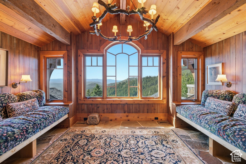 Vaulted wood-paneled ceiling with exposed beams