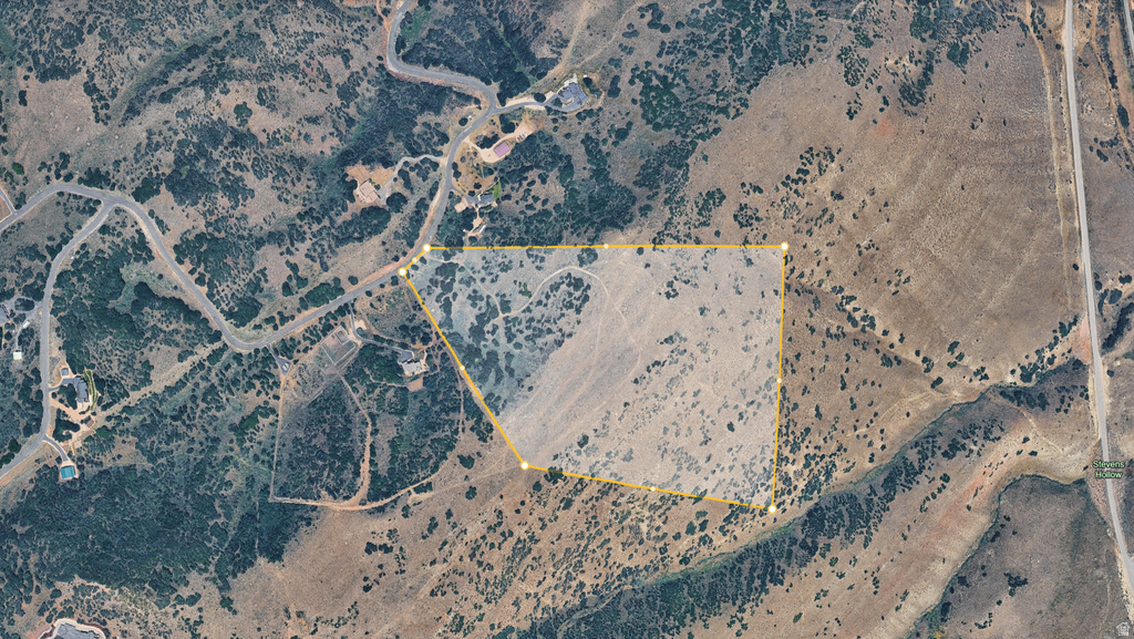 Aerial Property Map. Illustrating the property's boundaries and surrounding terrain