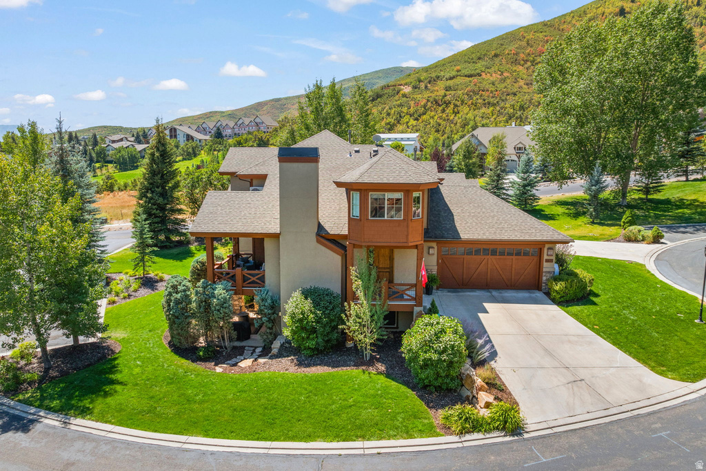 Stone and stucco exterior with wood trim accents