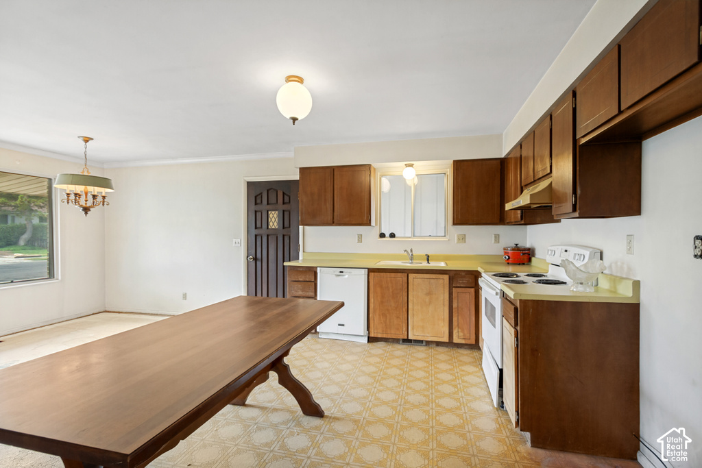 Kitchen area featuring wood-finish cabinetry, light-toned countertops, and geometric pattern flooring