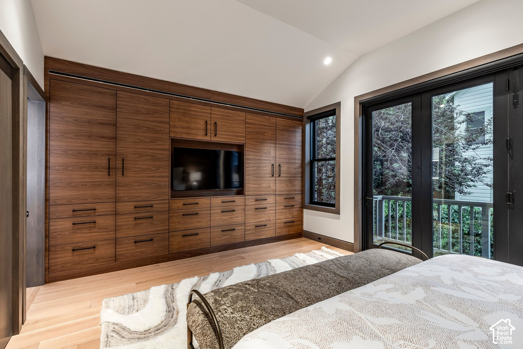 Built-in wood-finish cabinetry featuring multiple drawers and integrated media niche