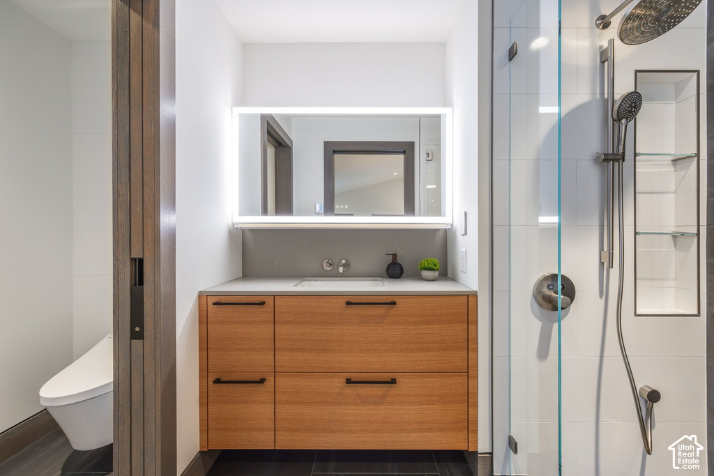 Contemporary bathroom featuring a wood-finish vanity with ample storage