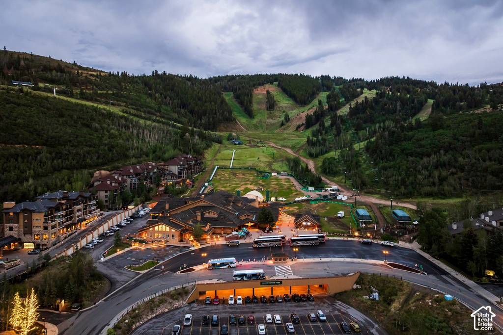 Expansive mountain property featuring a large resort-style complex, multiple multi-story residential buildings, and a ski slope backdrop