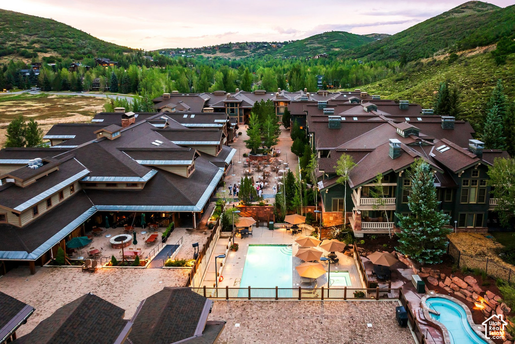 Expansive complex featuring multiple pitched roofs and a large central courtyard