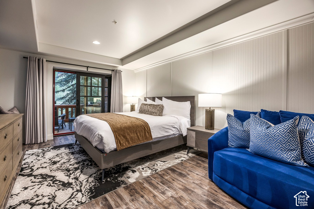 Wood-finish flooring throughout, complemented by a decorative area rug