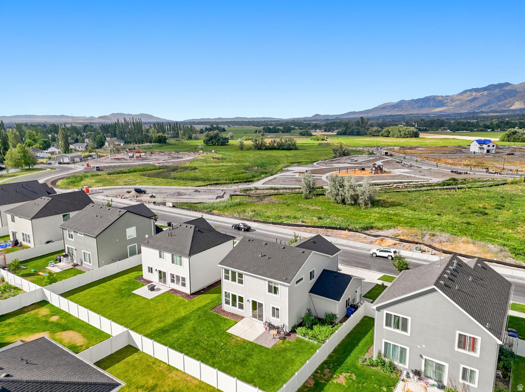 Modern residential development featuring a collection of two-story homes with dark shingled roofs