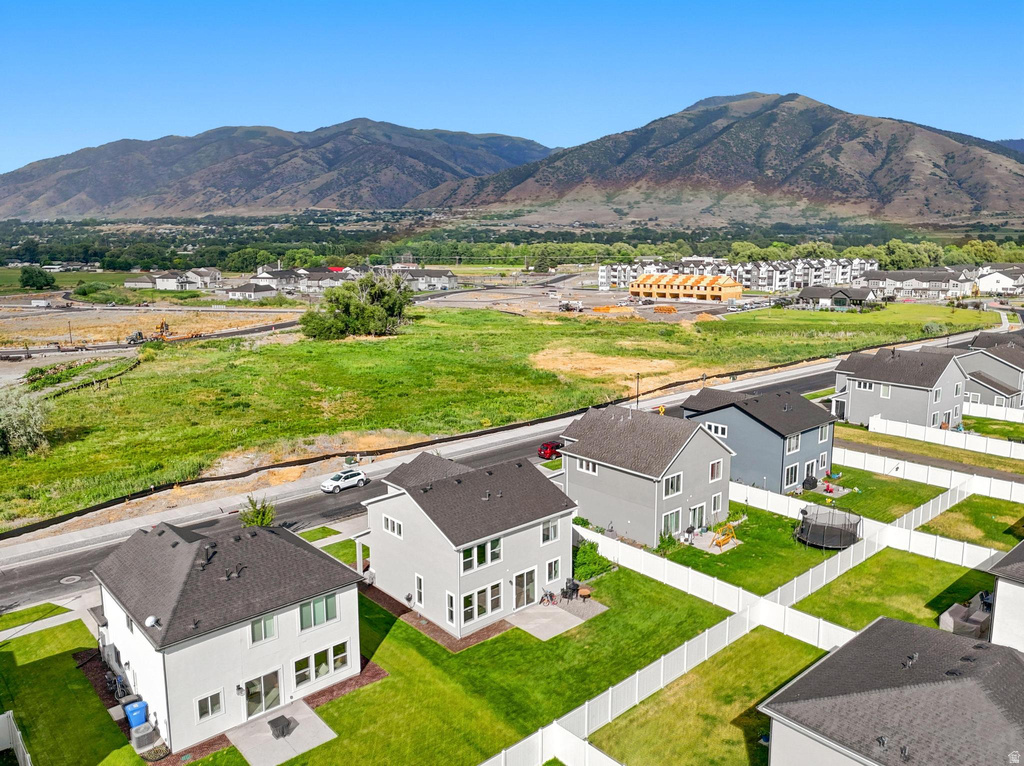 Aerial perspective showcasing a residential development with mountain scenery