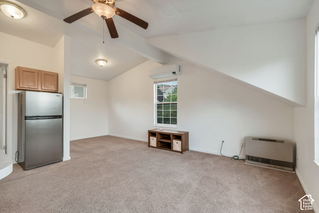 Carpeted room with a vaulted ceiling, recessed lighting, and a ceiling fan