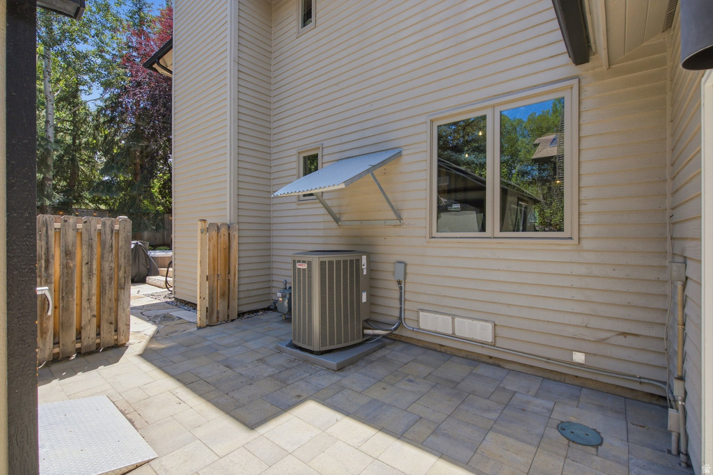Exterior patio space featuring paver stone flooring