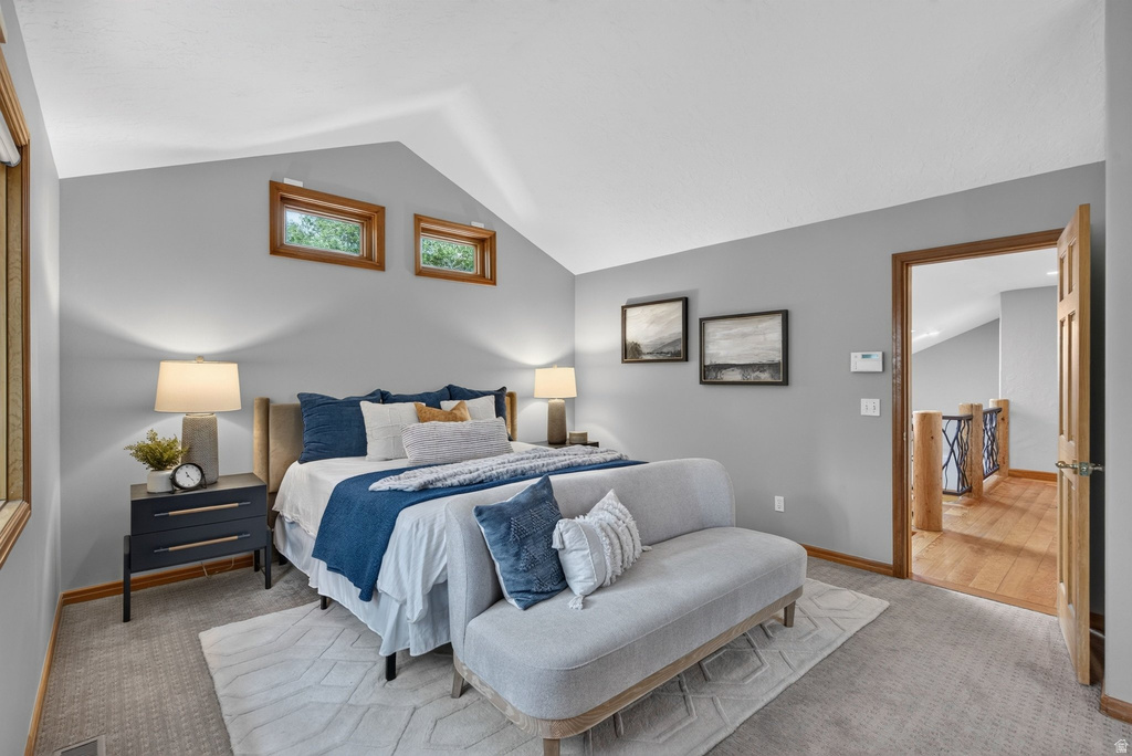 Vaulted ceilings with natural wood-trimmed windows