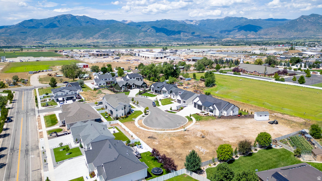Aerial overview of a residential development with mountain backdrops
