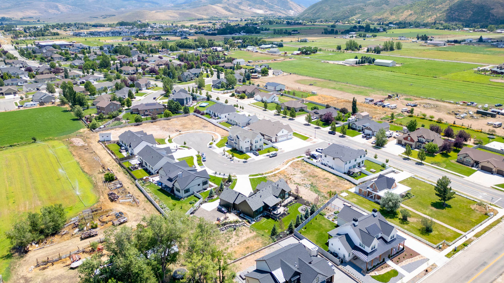 Aerial perspective showcasing a residential development with new construction homes