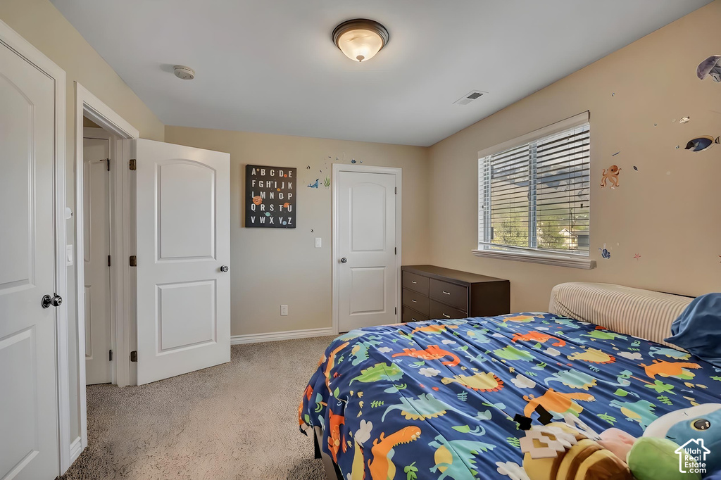 Neutral paint palette featuring light beige walls and a window with horizontal blinds