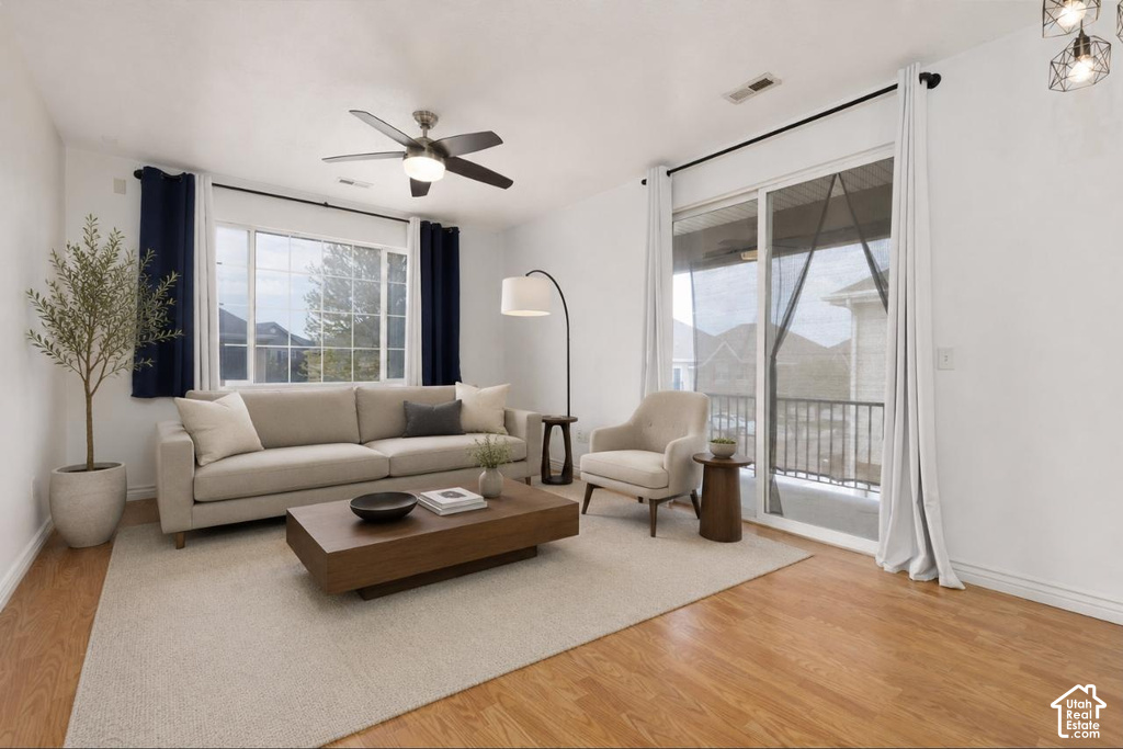 Bright living area featuring wood-finish flooring and a neutral color palette