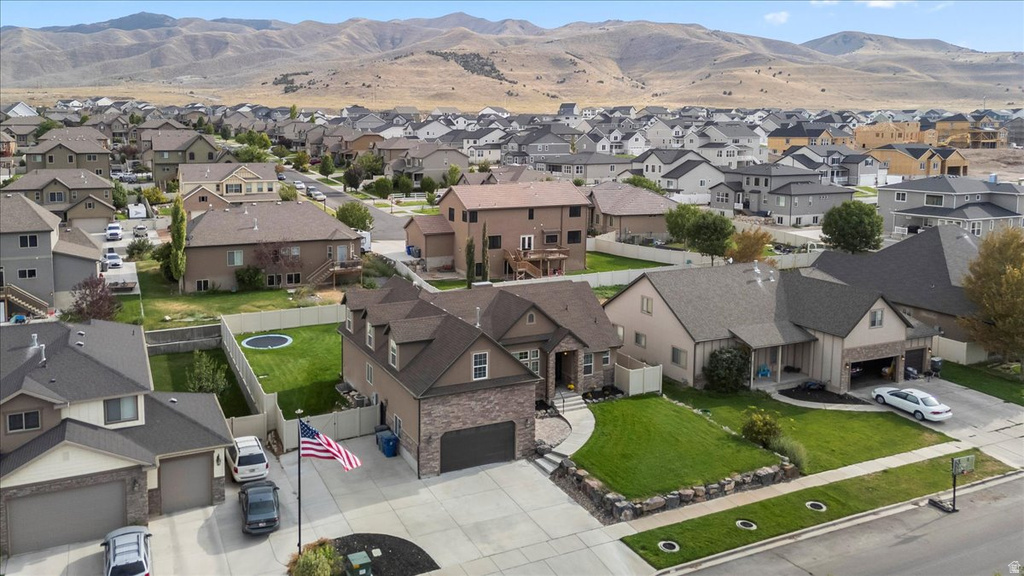 Residential neighborhood featuring a variety of single-family homes with mountain backdrops