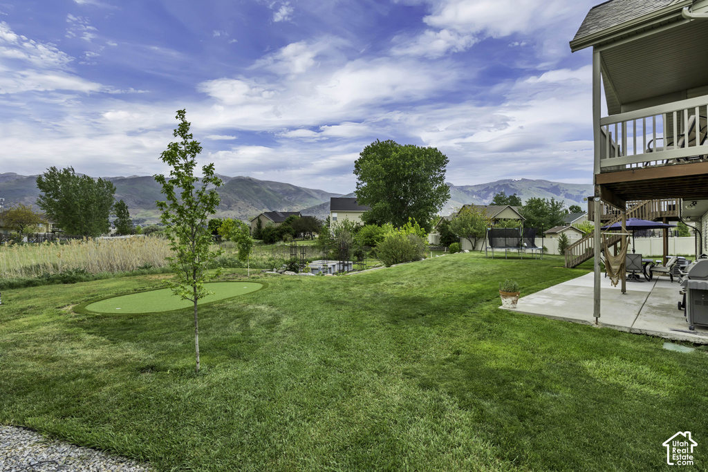 Expansive green lawn with a dedicated putting green
