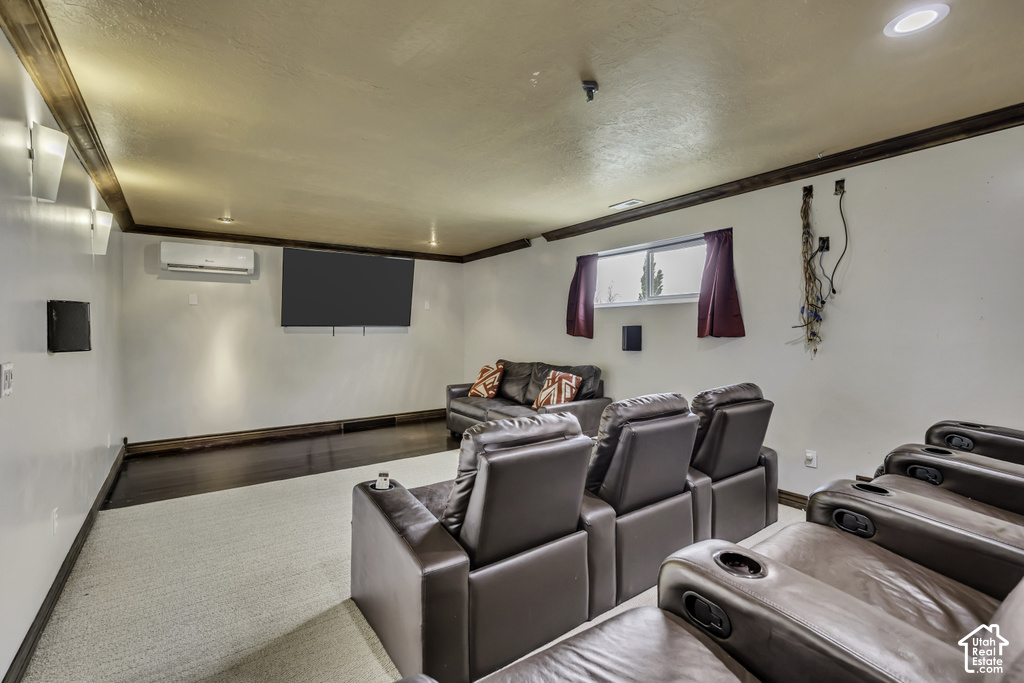 Entertainment room featuring a mounted television and dark wood-finish flooring