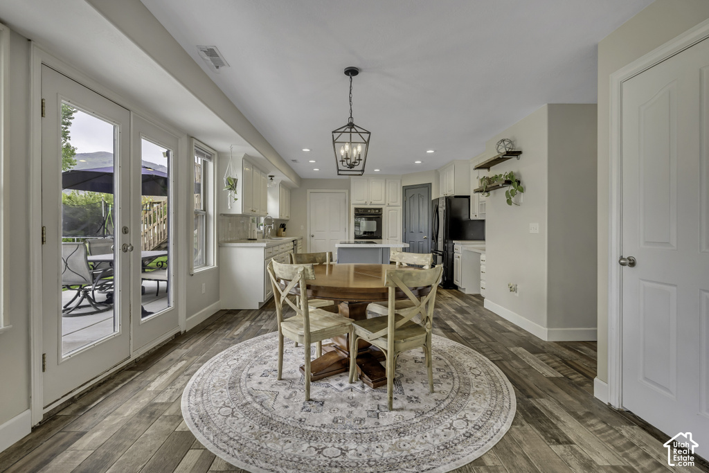 Open-concept living space with wood-finish flooring