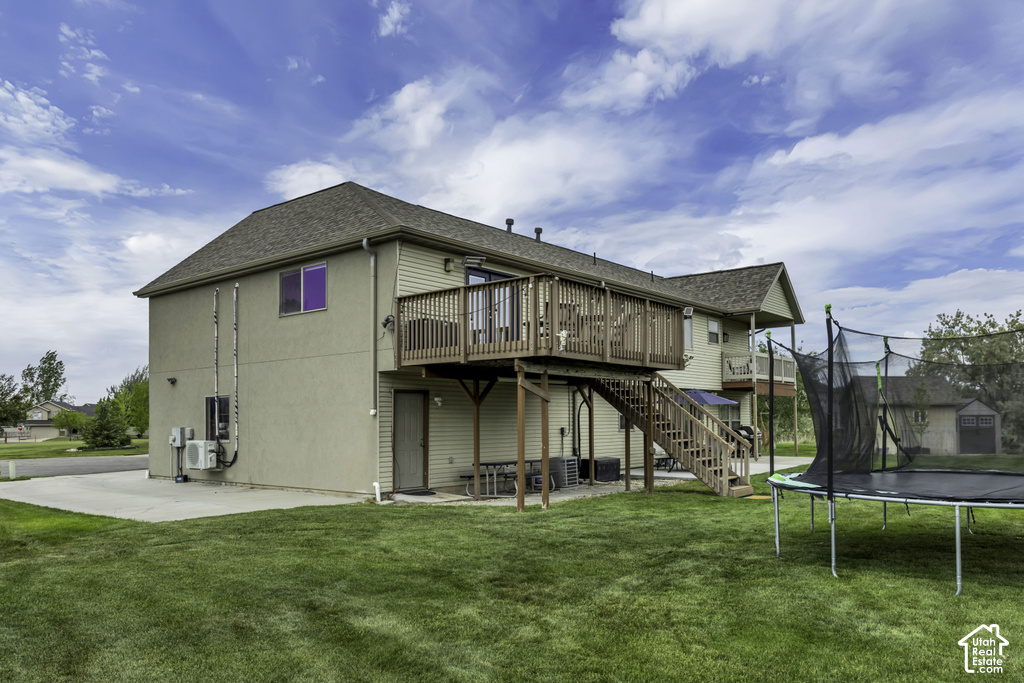 Two-story property with a wood-finish deck and exterior stairs