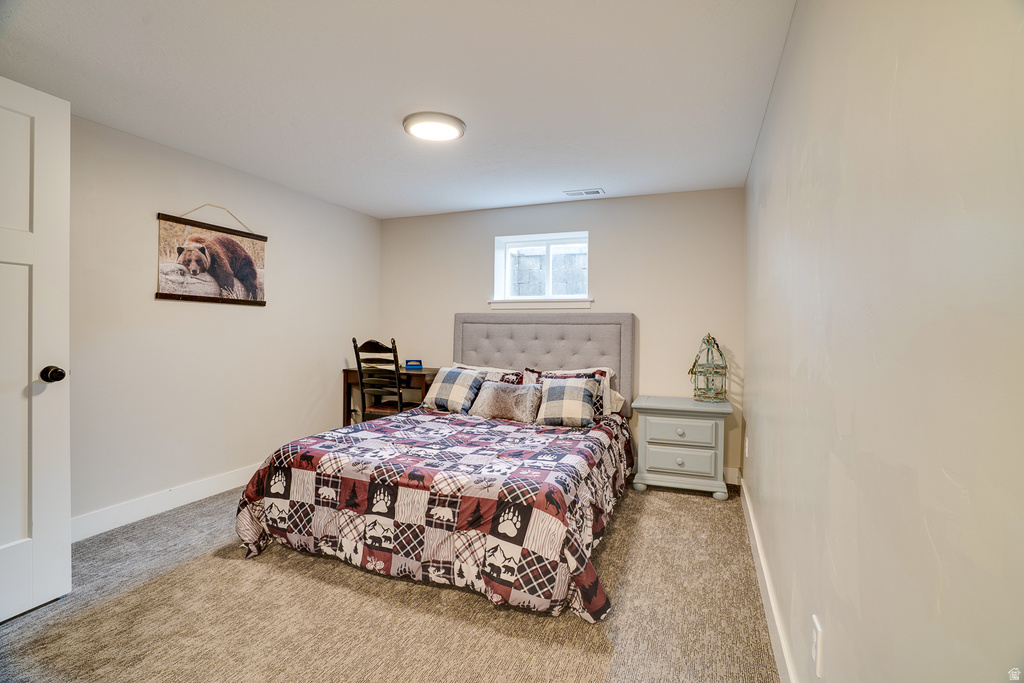 Room featuring neutral-toned walls, recessed lighting, and carpeted flooring