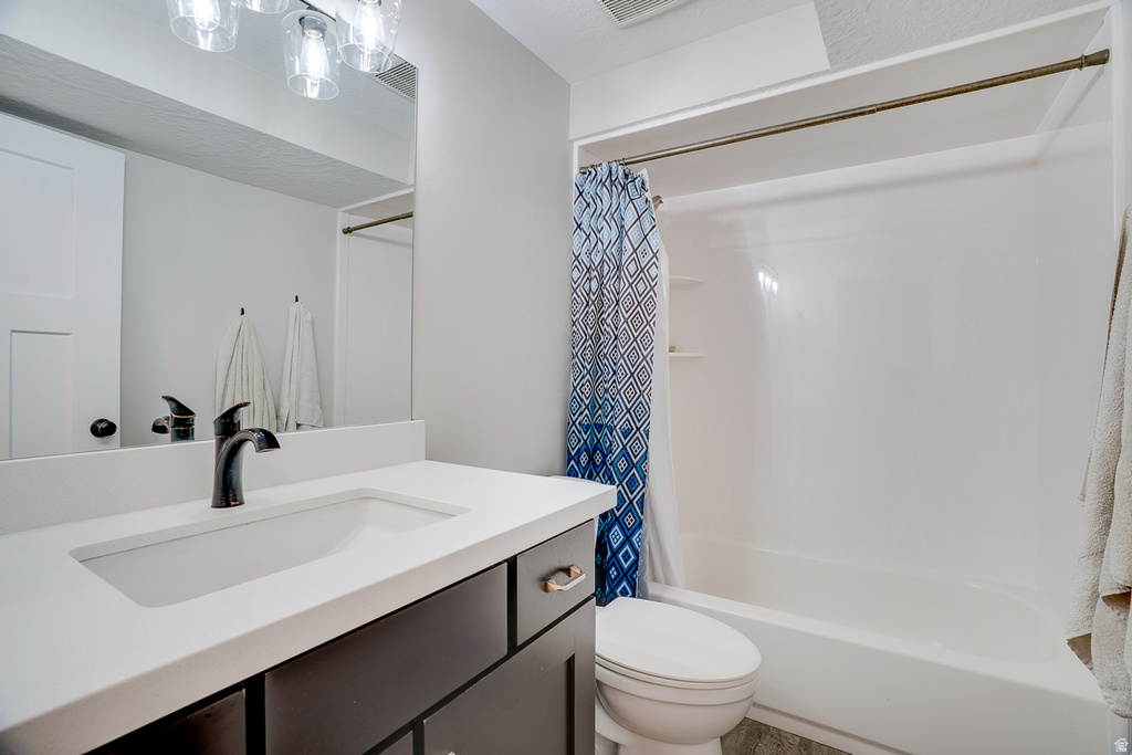 Bathroom vanity featuring a matte black faucet, integrated sink, and white countertop