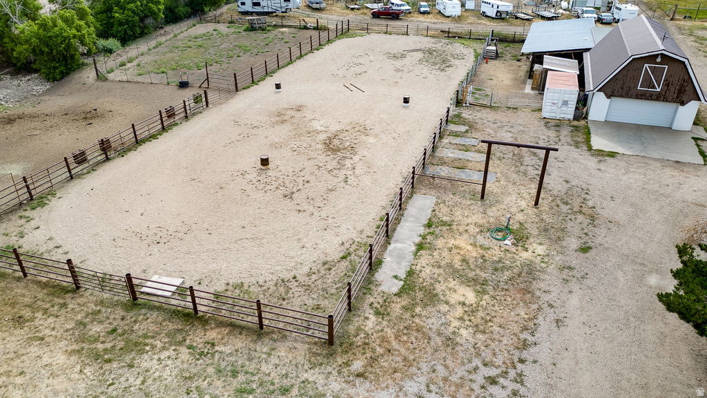 Fenced outdoor arena with sandy footing